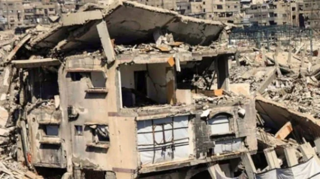 Sebuah bangunan hancur di kawasan Gaza Palestina (news of Bahrain)